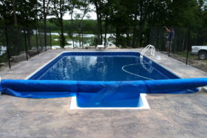 inground pool with solar cover